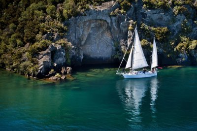 Viewing-the-Mine-Bay-Maori-Rock-Carvings-by-sailboat-large